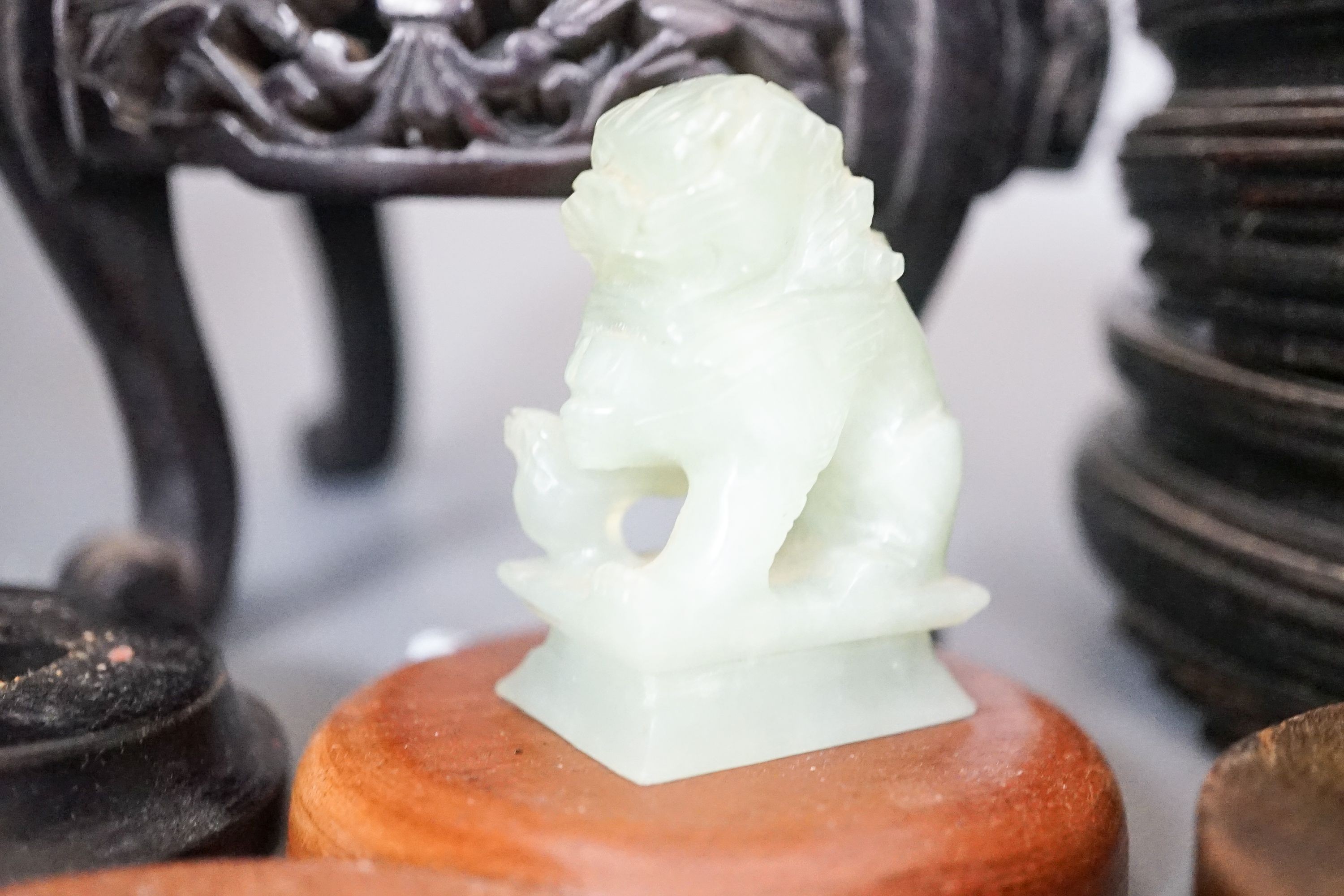 A group of Chinese wooden stands and stone carvings etc